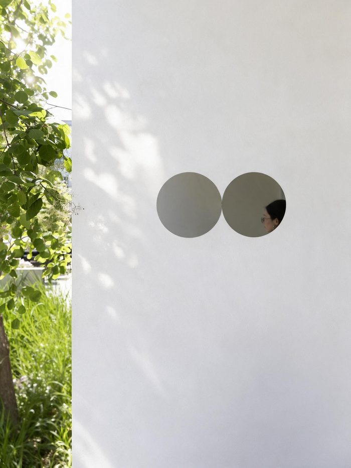 Two tangent circular mirrors — the tangency motif in our Beijing space